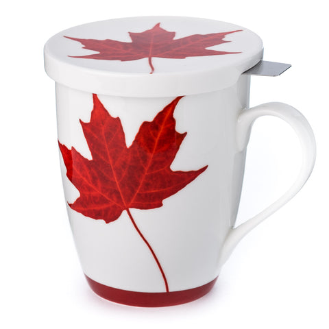 A white fine bone china tea mug and lid with a red maple leaf design and red bottom rim and a stainless steel infuser. 
